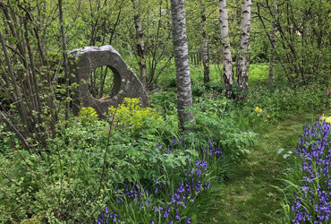 wild garden round statue